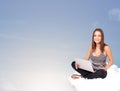 Young woman sitting on cloud with copy space Royalty Free Stock Photo