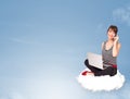 Young woman sitting on cloud with copy space Royalty Free Stock Photo