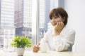 Young woman sitting with a cup of coffee Royalty Free Stock Photo