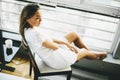 Young woman sitting and daydreaming on a chair Royalty Free Stock Photo