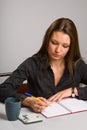 Young woman sitting at desk Royalty Free Stock Photo