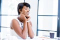 Young woman sitting at a desk in an office and working on blueprint Royalty Free Stock Photo