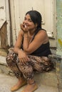 Young woman sitting in doorway Havana