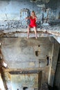 Young woman sitting on the edge in abandoned const Royalty Free Stock Photo