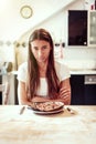 Young Woman Is Unhappy With Her Burnt Pizza For Lunch Royalty Free Stock Photo