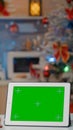 Young woman sitting at home in kitchen with decorations Royalty Free Stock Photo