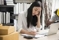 Young woman sitting in a home office with her laptop, Stressful Royalty Free Stock Photo