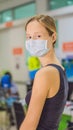 Young woman sitting in hospital waiting for a doctor`s appointment. Patients In Doctors Waiting Room VERTICAL FORMAT for Royalty Free Stock Photo