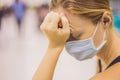 Young woman sitting in hospital waiting for a doctor`s appointment. Patients In Doctors Waiting Room Royalty Free Stock Photo