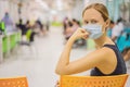 Young woman sitting in hospital waiting for a doctor`s appointment. Patients In Doctors Waiting Room Royalty Free Stock Photo