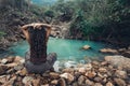 Young woman sitting by the lake in jungles Royalty Free Stock Photo