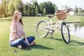 Young woman sitting on the lawn enjoying the moment Royalty Free Stock Photo