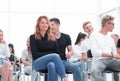 Young woman sitting among the listeners of the business seminar Royalty Free Stock Photo