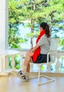 A young woman sitting at luxury villa