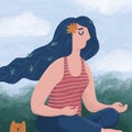 Meditating woman and a funny cat sitting outdoors