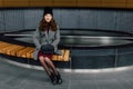 Young woman sitting in office buinding