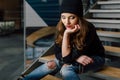 Young woman sitting in office buinding