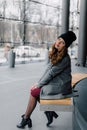 Young woman sitting in office buinding