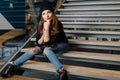 Young woman sitting in office buinding