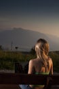 Young woman sitting outdoors with a laptop Royalty Free Stock Photo