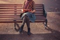 Young woman sitting on park bench with book Royalty Free Stock Photo