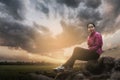 Young woman sitting in the park Royalty Free Stock Photo