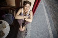 Young woman sitting in the pub window Royalty Free Stock Photo