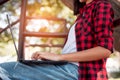 Young woman sitting on step using laptop. College woman is studying with laptop Royalty Free Stock Photo