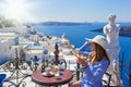 Young woman in a restaurant over the sea Royalty Free Stock Photo