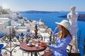 Young woman in a restaurant over the sea Royalty Free Stock Photo