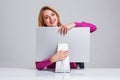 Young woman sitting in the table and using computer Royalty Free Stock Photo