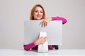 Young woman sitting in the table and using computer Royalty Free Stock Photo