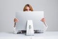 Young woman sitting in the table and using computer Royalty Free Stock Photo