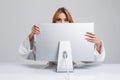 Young woman sitting in the table and using computer Royalty Free Stock Photo