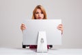 Young woman sitting in the table and using computer Royalty Free Stock Photo