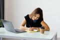 Young woman sitting at a table and writing notes. Businesswoman working at her desk Royalty Free Stock Photo