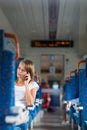 Young woman sitting in the train Royalty Free Stock Photo