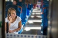 Young woman sitting in the train Royalty Free Stock Photo