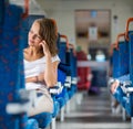 Young woman sitting in the train Royalty Free Stock Photo