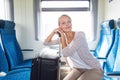 Young woman sitting in the train Royalty Free Stock Photo