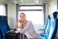 Young woman sitting in the train Royalty Free Stock Photo