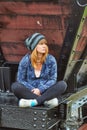 Young woman sitting on a train wagon Royalty Free Stock Photo