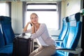 Young woman sitting in the train Royalty Free Stock Photo