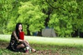 Read a book sitting under a blossom tree Royalty Free Stock Photo