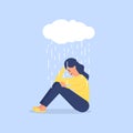Young woman sitting under rain, depression concept. Depressed, unhappy girl, woman sitting under rain cloud.