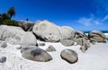 A young woman sittingon the boulders of clifton beach in the capetown area of south africa.6