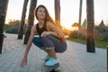 young woman with skateboard summer portrait