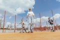 Young woman skating with her sons at playground. Happy family concept. Royalty Free Stock Photo