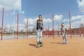 Young woman skating with her sons at playground. Happy family concept. Royalty Free Stock Photo