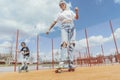 Young woman skating with her sons at playground. Happy family concept. Royalty Free Stock Photo